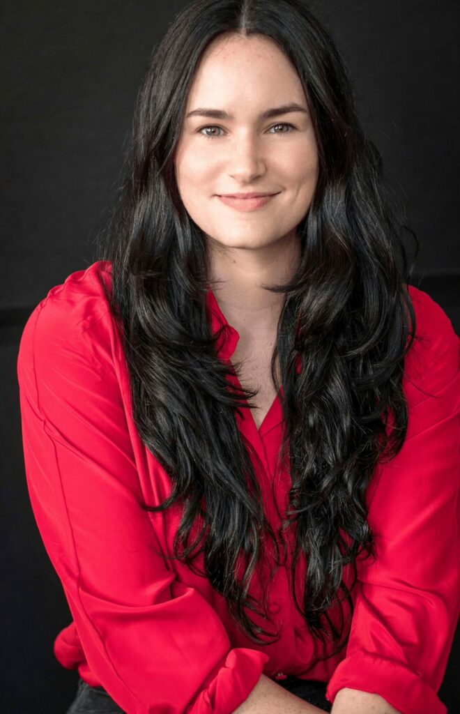 This is an image of Dominique Allamand a female real estate developer in Miami who is confident and friendly in this image.